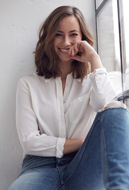 Woman in a white shirt smiling